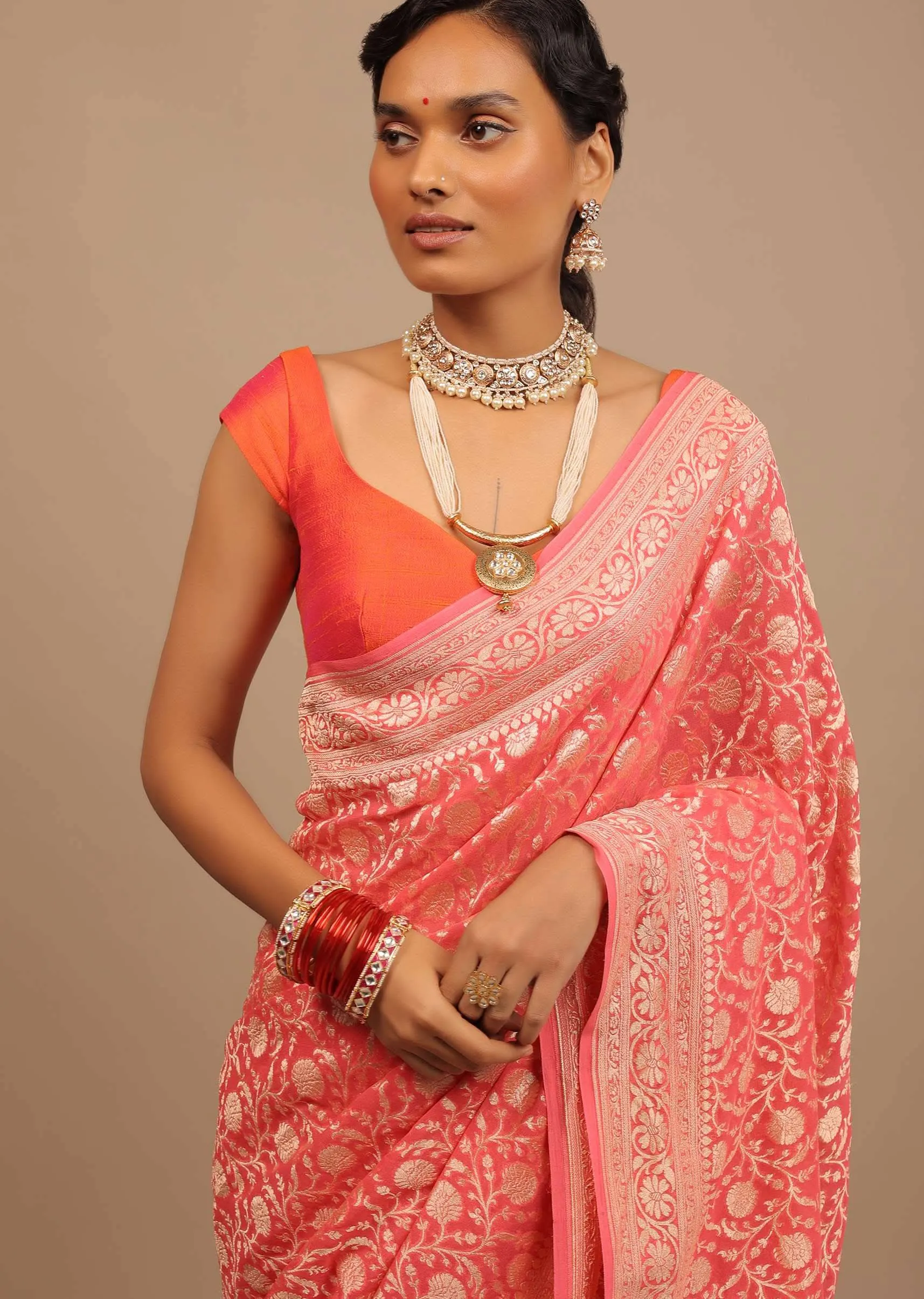 Coral Pink Saree In A Traditional Silhouette In Georgette With Floral Jaal Work