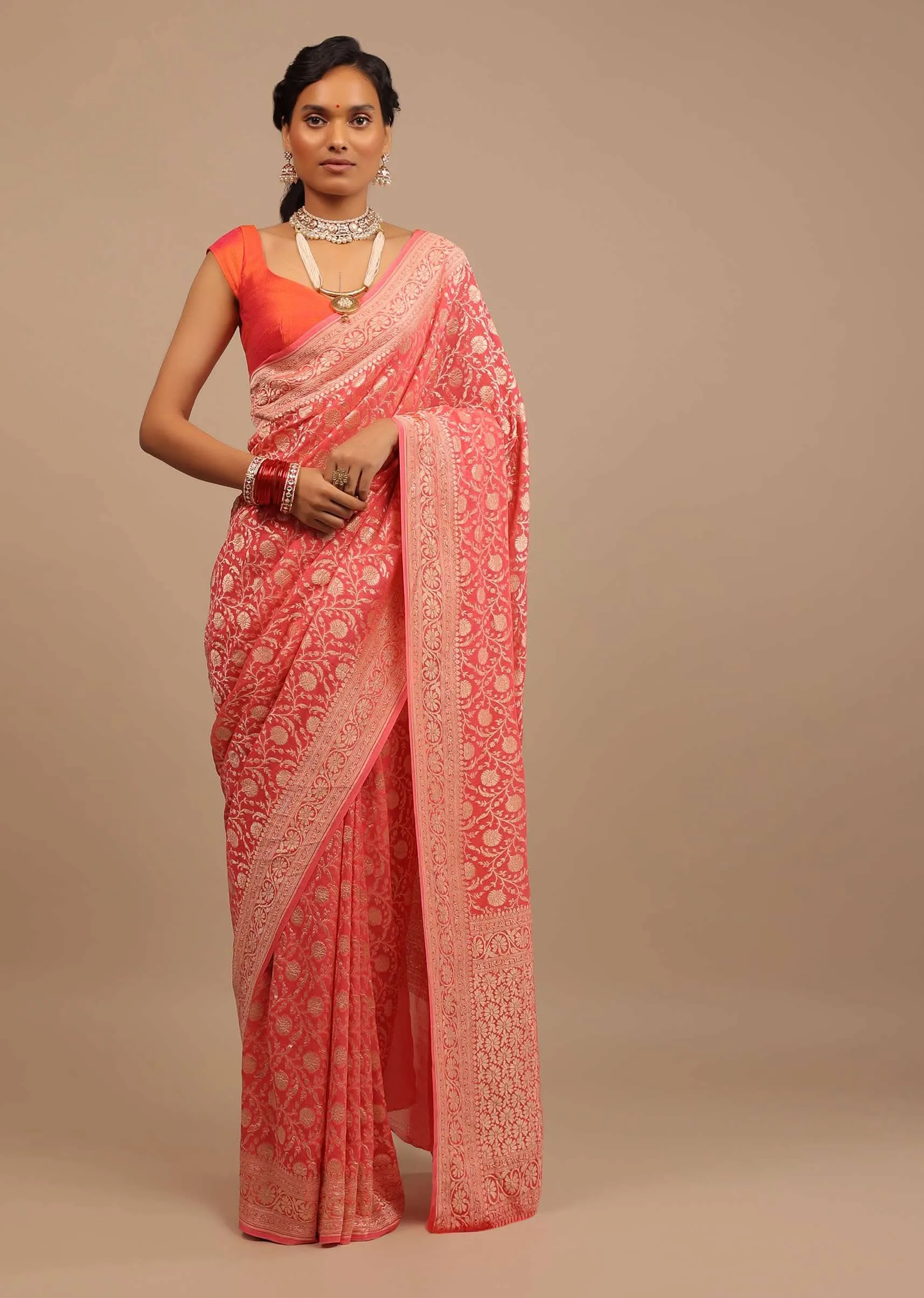 Coral Pink Saree In A Traditional Silhouette In Georgette With Floral Jaal Work