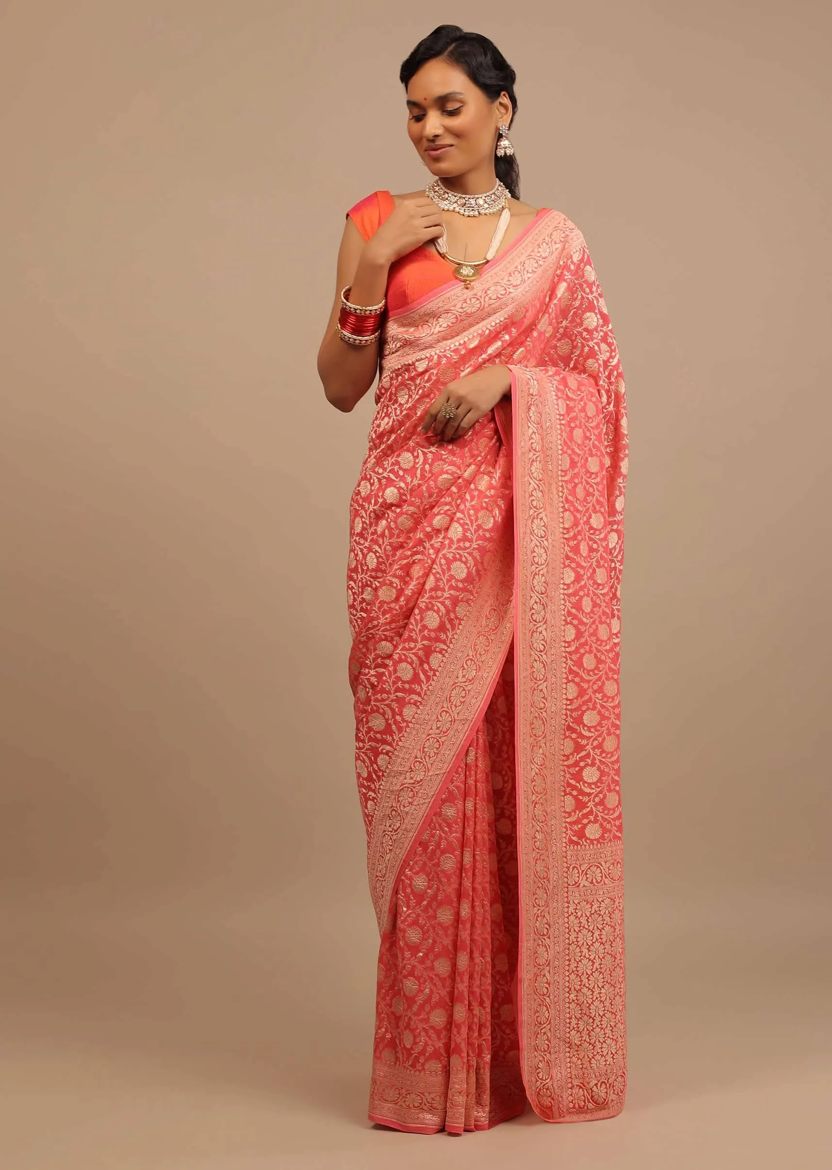 Coral Pink Saree In A Traditional Silhouette In Georgette With Floral Jaal Work