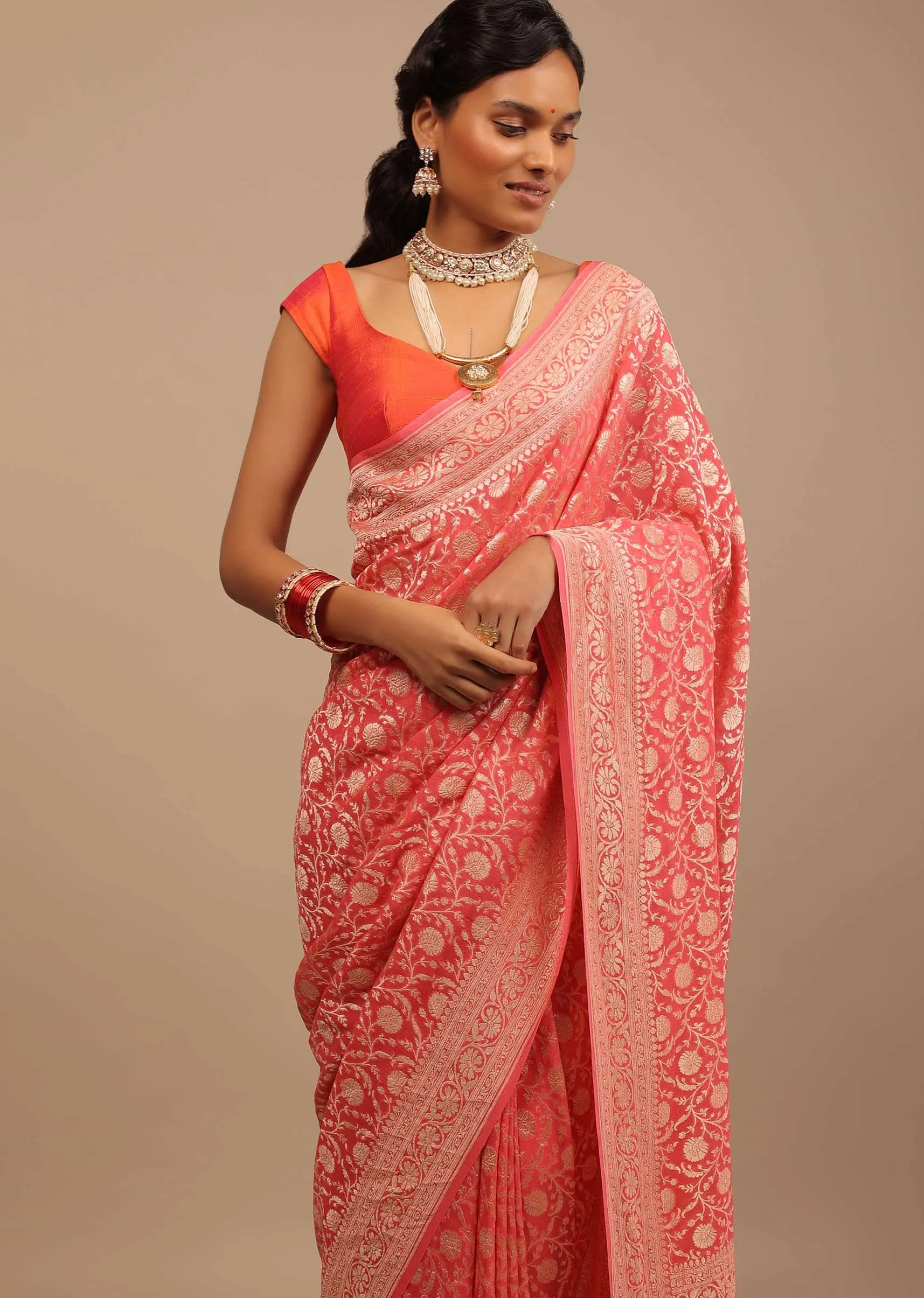Coral Pink Saree In A Traditional Silhouette In Georgette With Floral Jaal Work