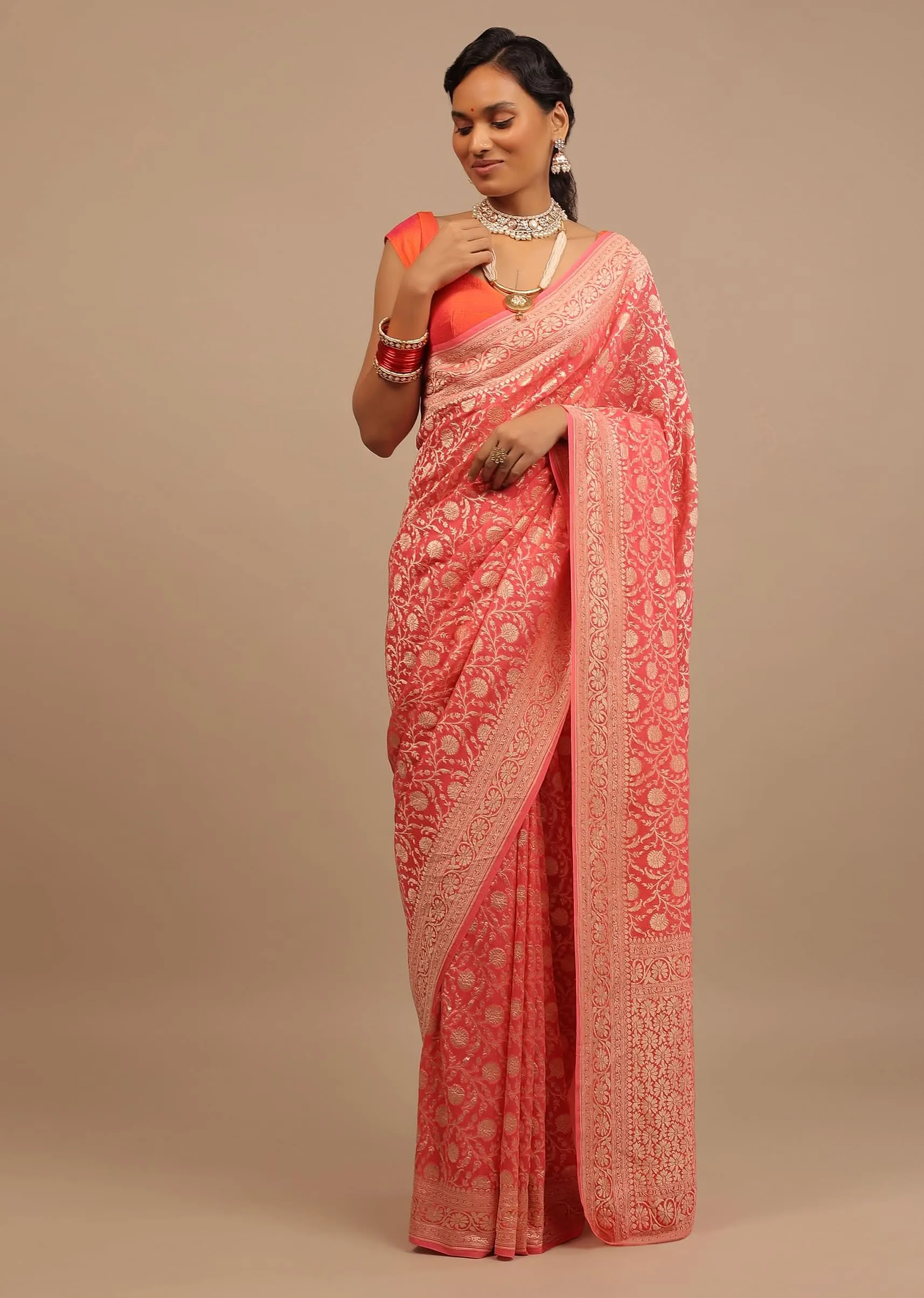 Coral Pink Saree In A Traditional Silhouette In Georgette With Floral Jaal Work